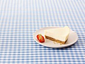 A slice of New York Cheesecake with strawberries