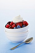 Fresh berries with a dollop of whipped cream