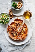 Quiche Lorraine with parsley and salad