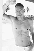 A fit, topless middle-aged man