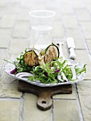 A salad of grilled scallops wrapped in courgette
