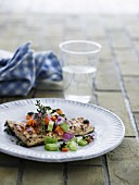 Grilled fish steak with a vegetable salad and thyme