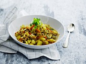 Vegetable stew with pork mince and pasta in a soup bowl
