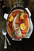 Fish with lemons and tomatoes