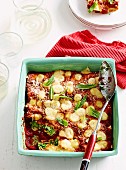 Cannelloni with spinach and broad beans in a casserole dish (Italy)