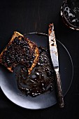 A slice of bread with blueberry jam