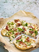 Pizza with bacon and peas