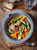 Pork stew with broccoli, celery, sweet potatoes and sage