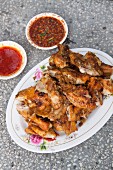 Fried chicken bits with spicy sauce