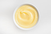 Vanilla pudding in white bowl