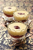 Vanilla pudding with red berry compote in dessert bowls