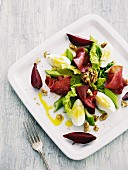A salad of bresaola, egg, walnuts, celery and beetroot