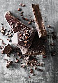 Broken dark chocolate with cocoa beans