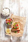 Baked salmon with avocado and tomato salsa and rice