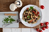 Fried mushrooms with tomatoes and parsley