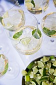 A Hugo cocktail with limes and mint