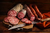 Various types of salami on a chopping board