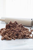 Chocolate dough for cookies with a rolling pin