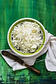 A bowl of sliced white cabbage