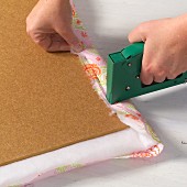 Hand-crafting a pinboard - stapling fabric to a backing board