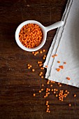A bowl of red lentils on a cloth