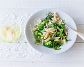 Spelt pasta with broccoli, rocket and pine nuts