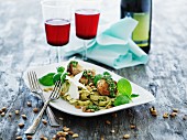 Fish balls with tagliatelle, basil pesto, Parmesan cheese and pine nuts