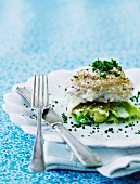 Baked cod on a bed of leek with grated Parmesan cheese, chives and a white wine and cream sauce