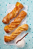 Puff pastry twists with sugar and vanilla cream