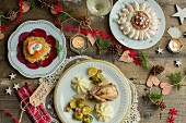 Christmas dinner, potato pancake with smoked salmon and beetroot, quail with Brussels sprouts and parsnip puree, Mont Blanc pavlova with chestnut puree