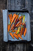 Various carrots on a baking tray