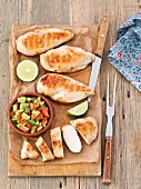 Grilled chicken breast with tomato and avocado salsa