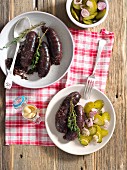 Grilled black pudding with a gherkin salad and mustard