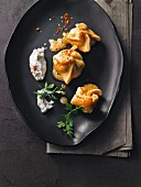 Pasta and mushroom dumplings with dill yogurt and chilli butter