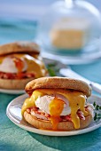 Eggs Benedict (muffins with poaches eggs and sauce Hollandaise)