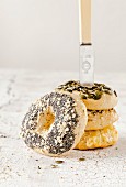 A tower of bagels with a knife