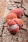 Lychees on a wooden surface