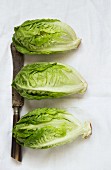 Three lettuces with an old knife
