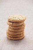 A stack of cookies on a tablecloth