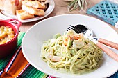 Spaghetti with shrimps and avocado