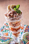 Banana and nut parfait with mint leaves