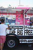 Customers buying sweets at a food truck festival in California, USA