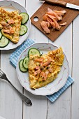 Omelette with smoked salmon and cucumber slices