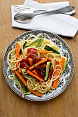 Spaghetti with courgette, carrots and tomato sauce (seen from above)