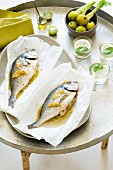 Seabream with green tomatoes and fennel in parchment paper