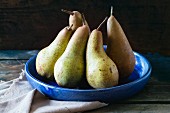 Pears in blue ceramic bowl