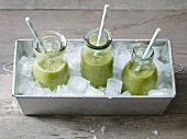 Green smoothies with rocket, banana, apple and orange juice