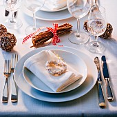 A festive place setting with Christmas decorations