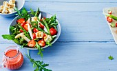 Green and white asparagus salad with strawberries and walnut feta cheese