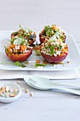 Grilled peaches filled with barley salad